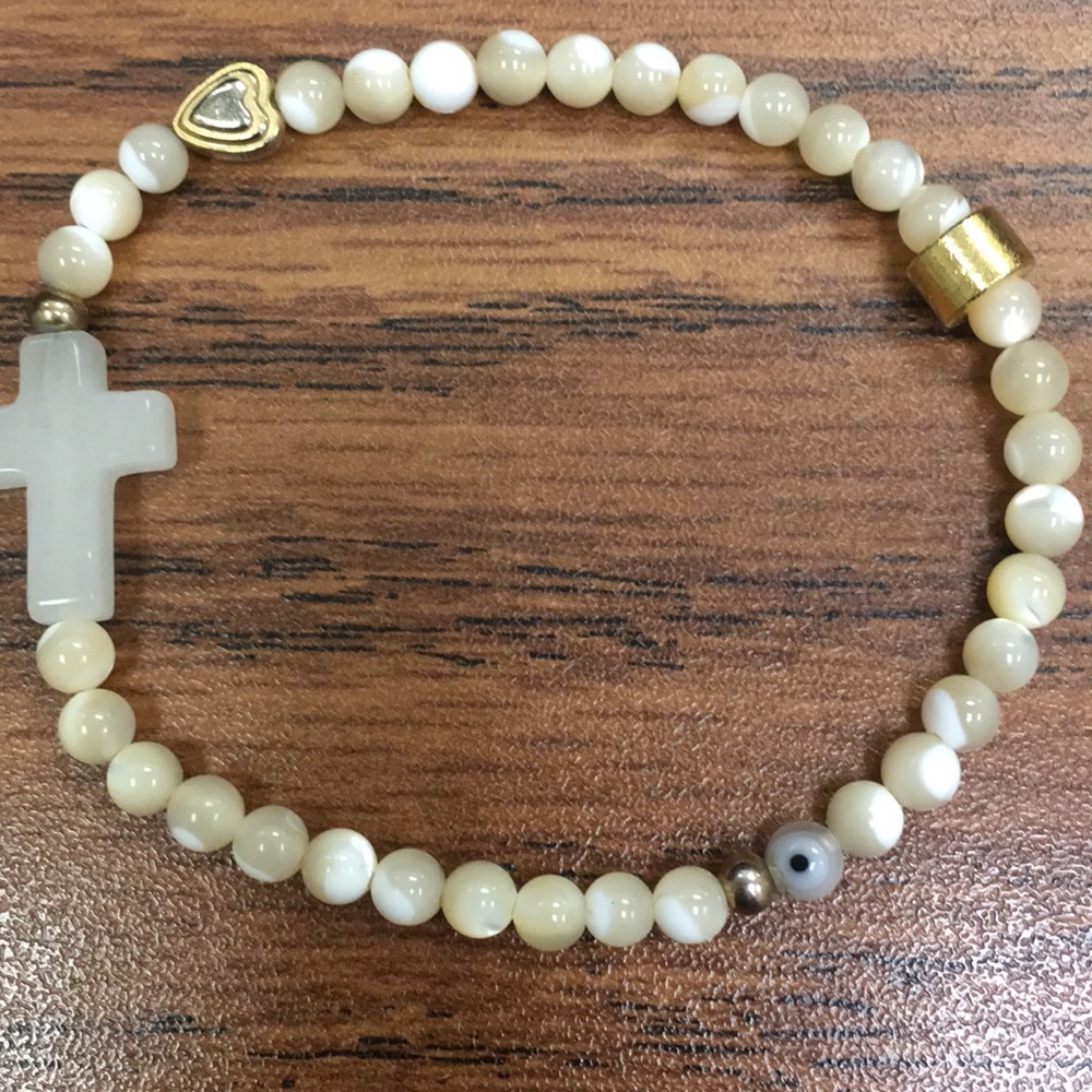 White cross bracelet with gold detail - Picture 2 of 6